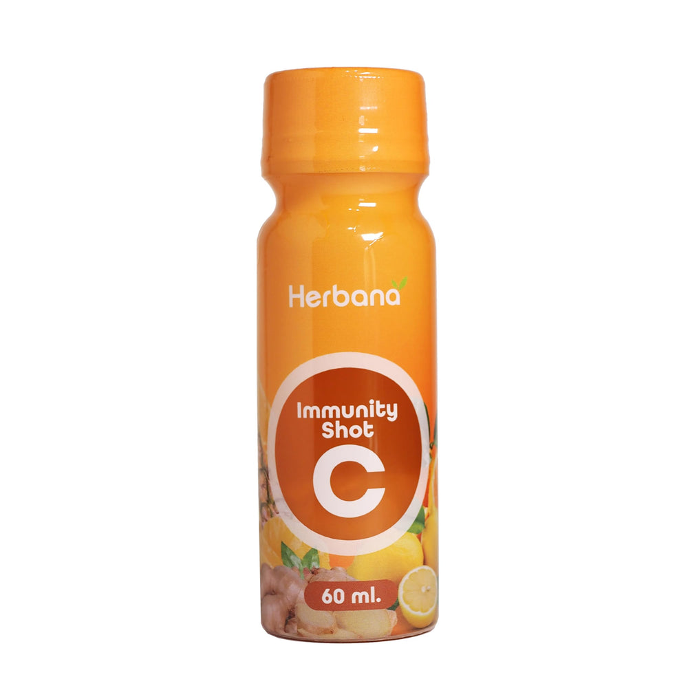HERBANA Immunity & Digestive Shot chilled glass; refreshing, ready-to-drink option for busy days.