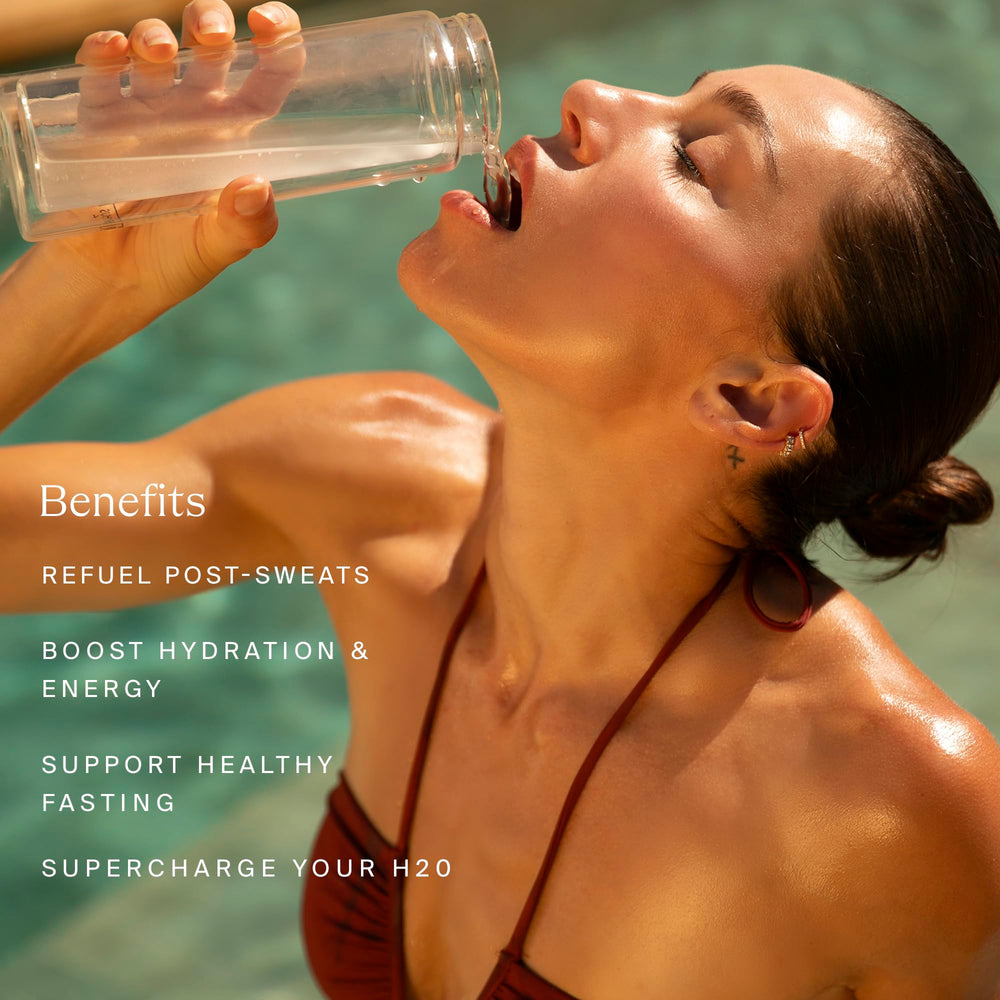 HigherDOSE HIGH-DRATION powder packet being mixed for on-the-go hydration