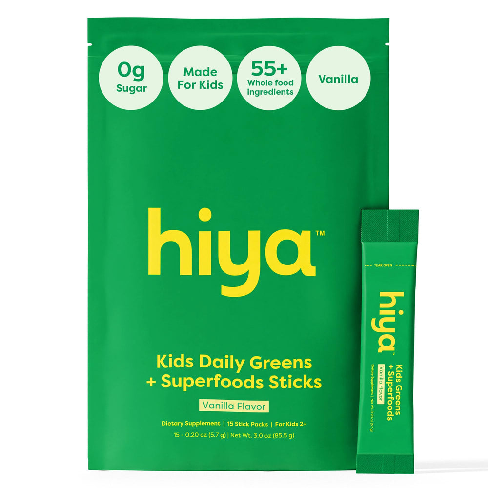 HIYA Kids Greens Powder Sticks Vanilla tub with milk for a delicious greens boost