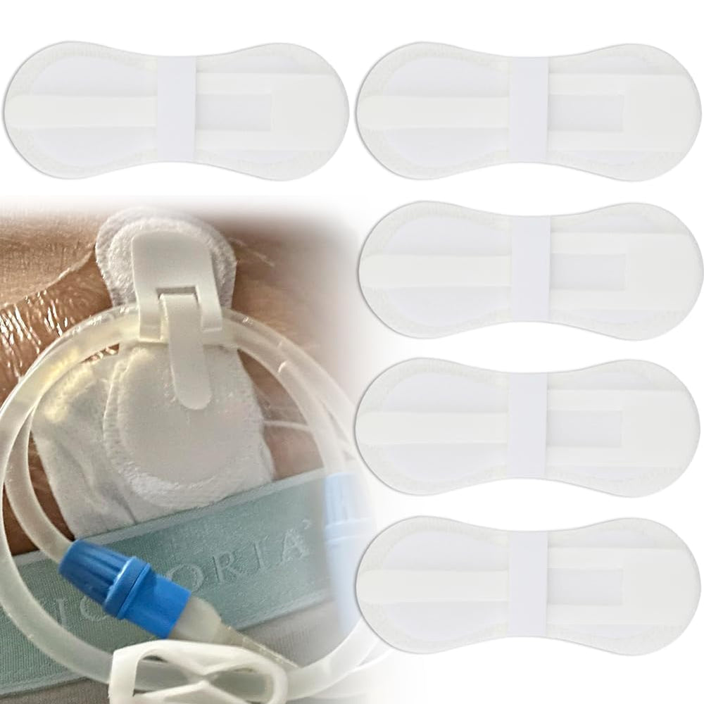 Hola Health low-profile G-tube holder secured on the stomach for discreet stabilization.