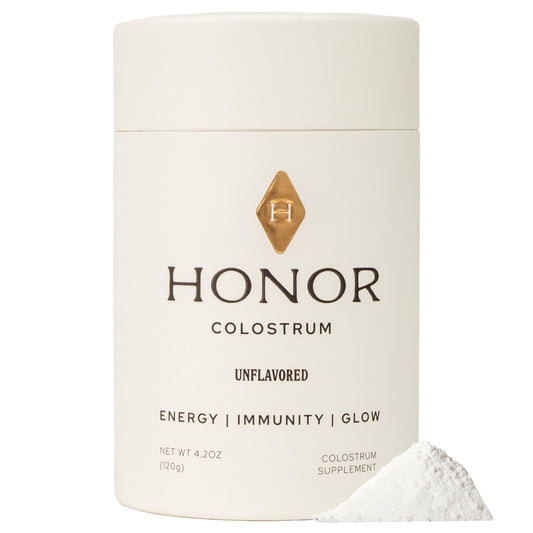 HONOR Supplements Colostrum Powder bottle on countertop, clean formula for everyday nourishment.