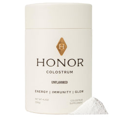 HONOR Supplements Colostrum Powder bottle on countertop, clean formula for everyday nourishment.