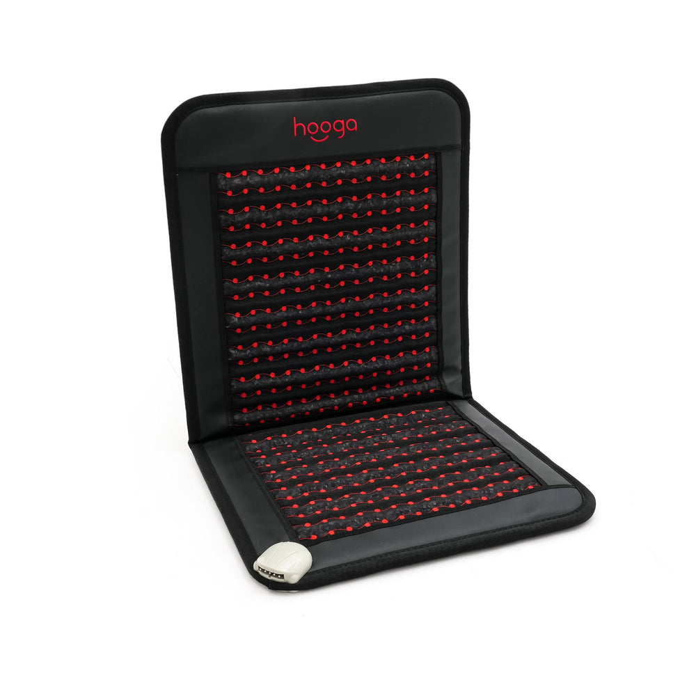 Hooga far infrared heat mat foldable for easy warmth beside a chair, ideal for quick sessions.