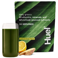 Huel Daily Greens lemon-ginger tub front for convenient daily nutrition.