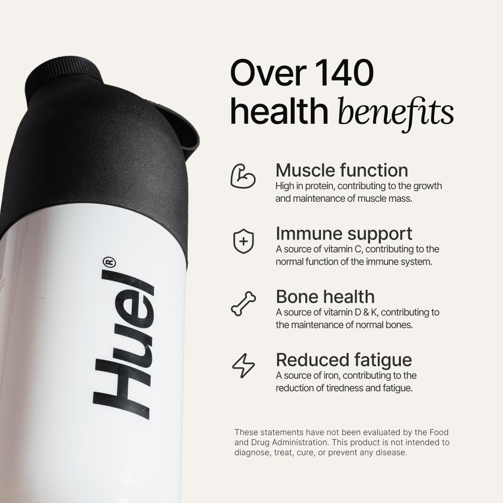 Huel protein powder scoop beside tub for quick serving.