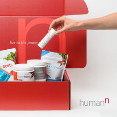 Humann SuperBeets Energy Plus glass of water ready for a gentle caffeine boost.