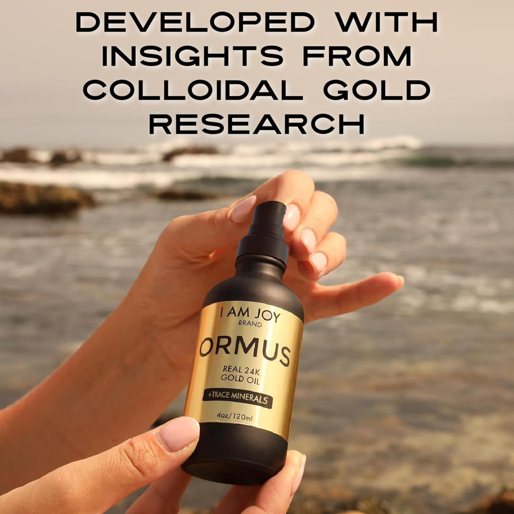 I Am Joy Co. Ormus Gold Oil 24k gold shimmer signaling luxury mineral content.
