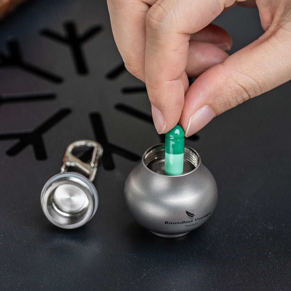 iBasingo pill case attached to a backpack for outdoor trips