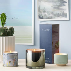 Illume Citrus Crush diffuser lifestyle desk setup with sunlit ambiance