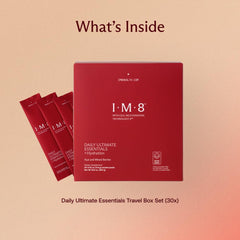 Glass with IM8 Daily Ultimate Essentials drink highlighting smooth berry flavor and hydration