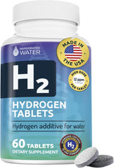 Invigorated Water hydrogen tablets dissolving in water to create hydrogen-rich hydration.