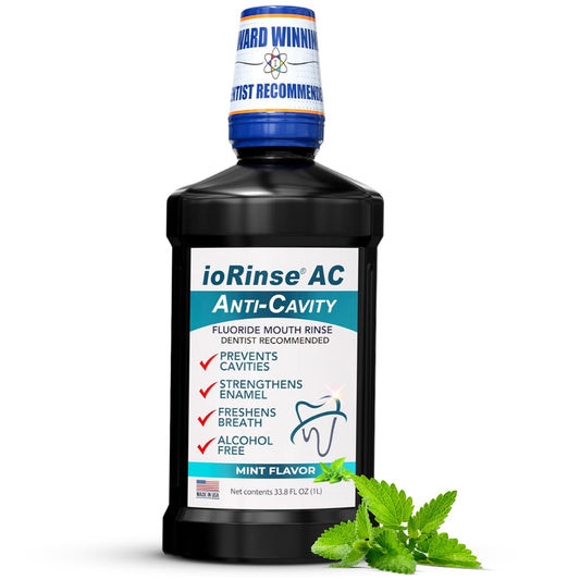 Iotech ioRinse AC bottle on a bathroom counter showing gentle alcohol-free fluoride protection.