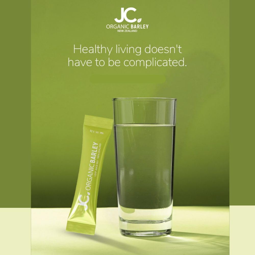 JC Barley Grass Juice Powder spoon beside bottle signals convenient on-the-go wellness