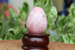 Jet International rose quartz egg in meditation space promotes calm focus.