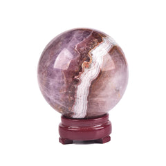 JIC Gem amethyst sphere on wooden stand with calming presence