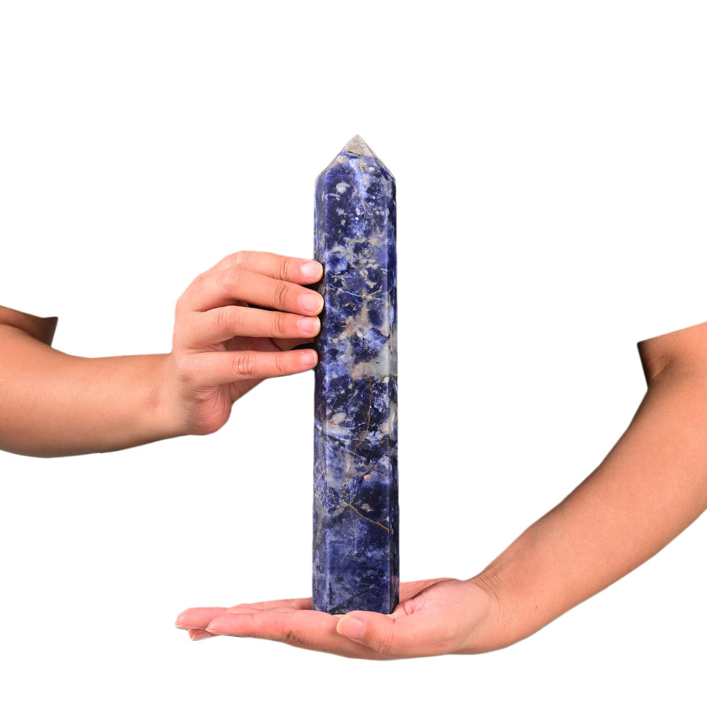 Close-up of JIC Gem blue sodalite obelisk texture highlighting natural patterns