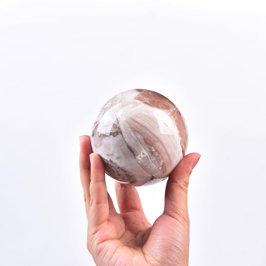 JIC Gem large pink crystal sphere with stand showcasing natural agate patterns for decor.