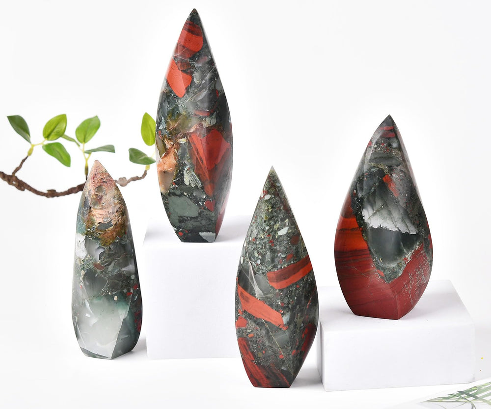 JIC Gem office/home decor crystal tower integrated on a shelf beside plants.