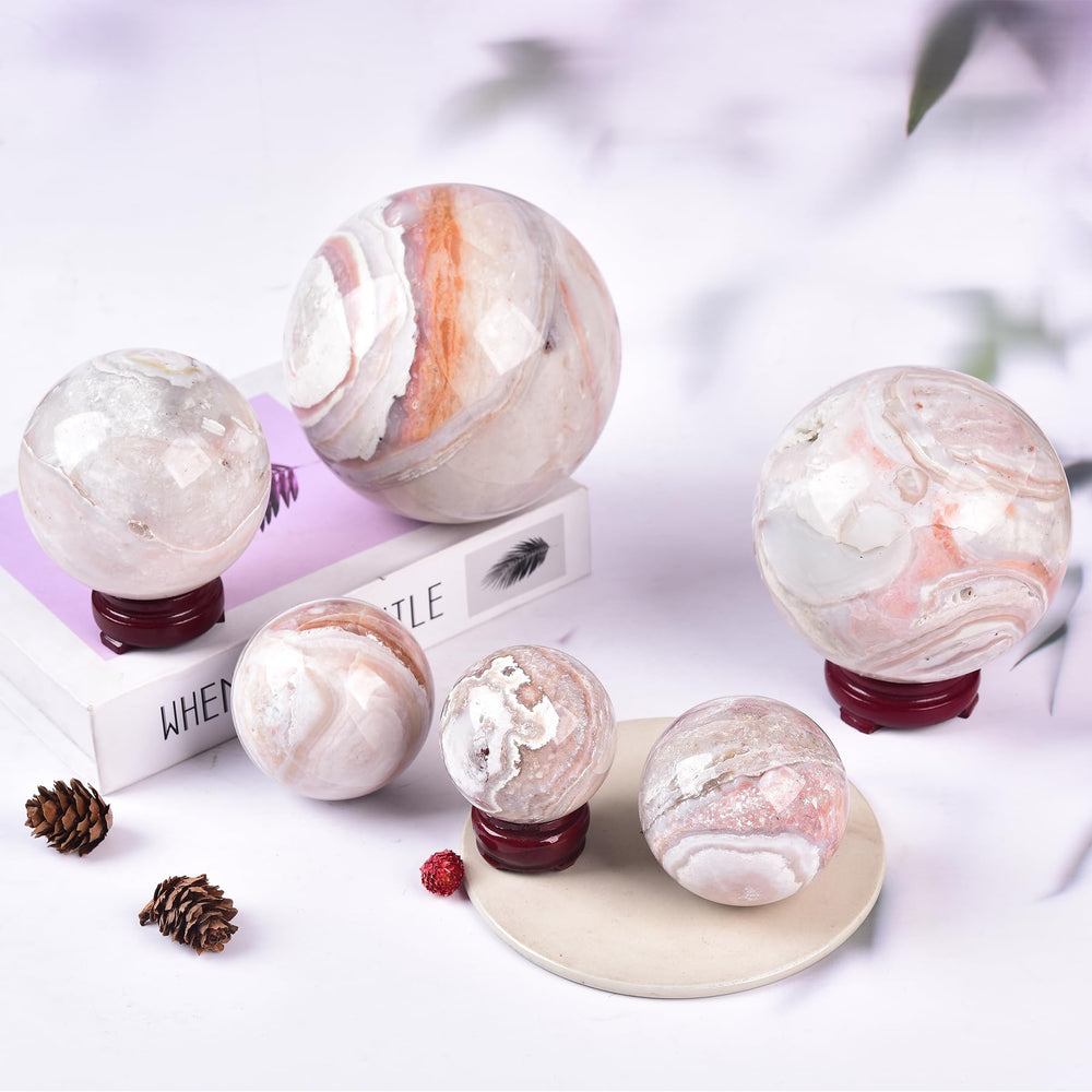 JIC Gem pink agate sphere with natural patterns for meditation ambience.