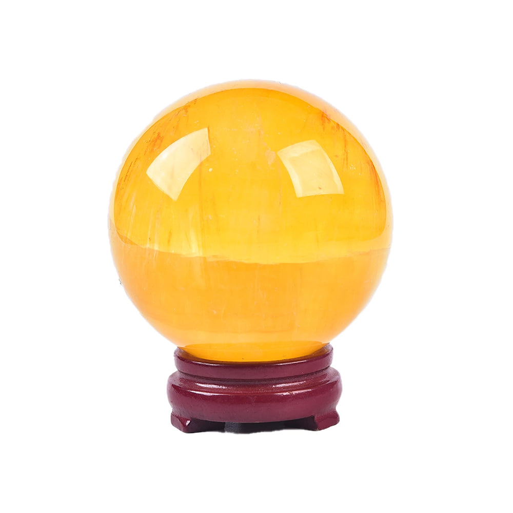 JIC Gem yellow fluorite sphere on wooden stand, showcasing natural texture for calm decor.