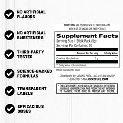 Pouring Jocko Fuel Creatine Stick Packs into a glass for quick mixing.