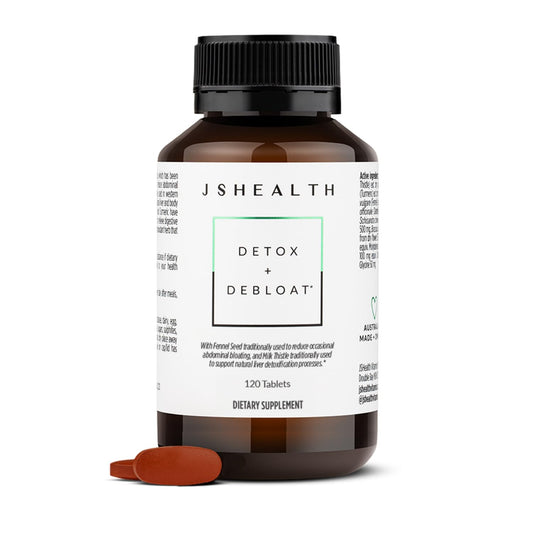 JSHealth Detox liver cleanse bottle on wood surface may support digestion.