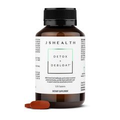 JSHealth Detox liver cleanse bottle on wood surface may support digestion.