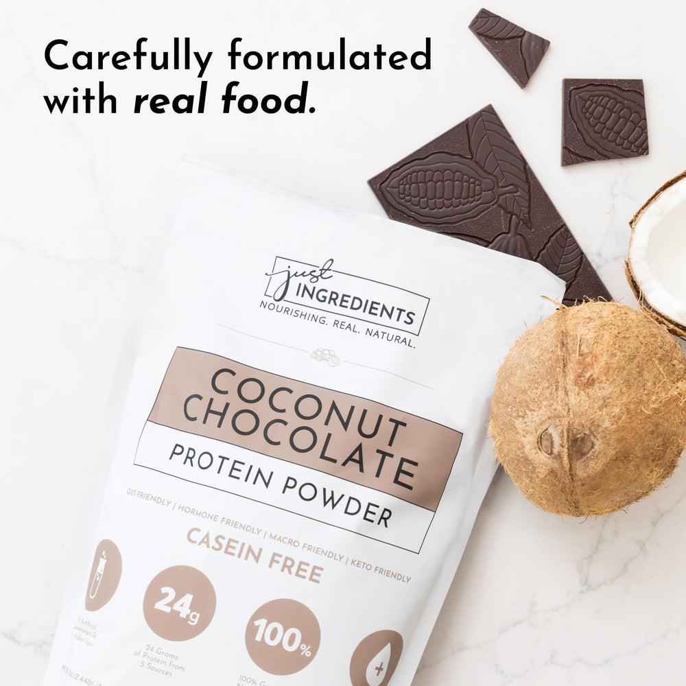 JUST INGREDIENTS Coconut Chocolate Protein Powder shaker mixes with tropical drink for convenient fitness fueling