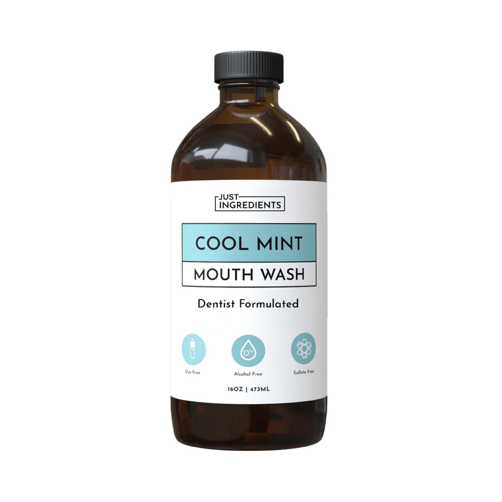 JUST INGREDIENTS Cool Mint mouthwash bottle highlights alcohol-free, enamel-friendly freshness for daily use.