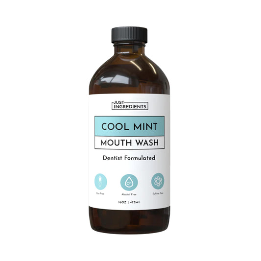 JUST INGREDIENTS Cool Mint mouthwash bottle highlights alcohol-free, enamel-friendly freshness for daily use.