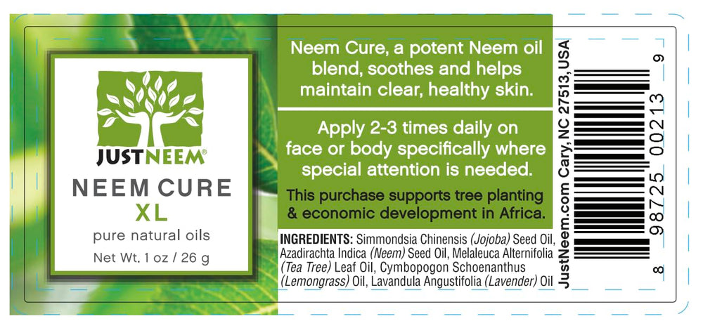 JustNeem Neem Cure Oil XL bottle on a skincare setup highlighting natural oils blend.