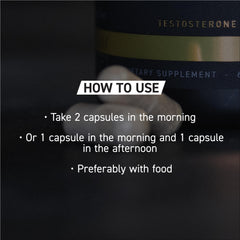 Kaged Ferodrox capsules resting beside a shaker bottle for workout-ready routine.