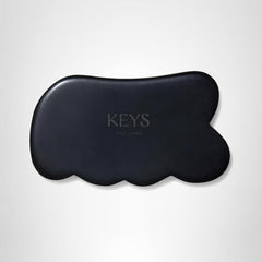 Keys Soulcare obsidian gua sha tool ready for at-home spa routine and calm energy.
