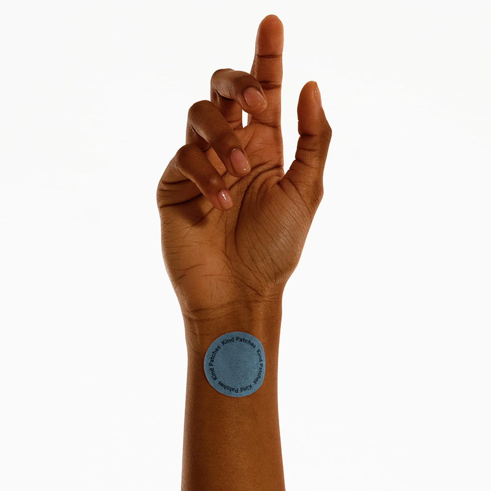 Kind Patches Melatonin Dream patch on wrist signals a simple nightly routine.