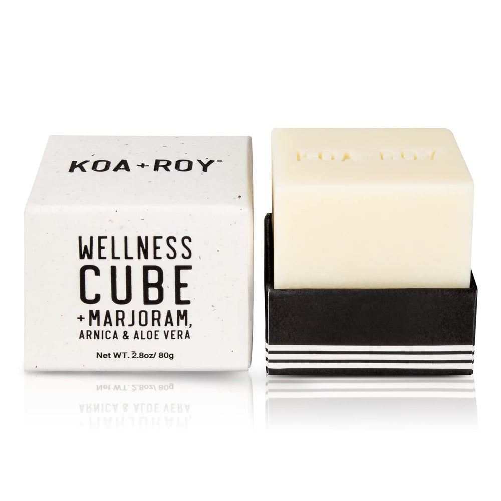 KOA ROY Wellness Cube being applied to skin for massage and hydration