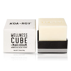KOA ROY Wellness Cube being applied to skin for massage and hydration