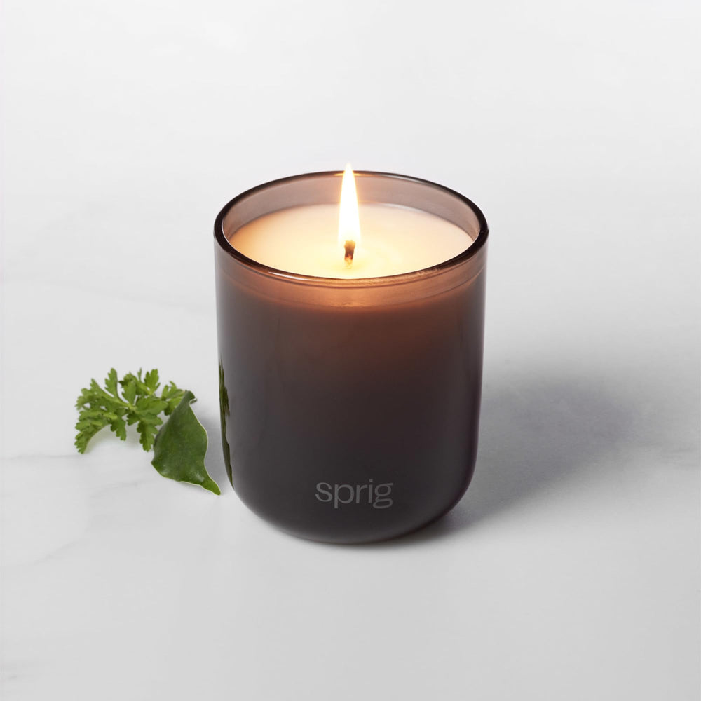 Sprig by Kohler candle lit to create calm ambiance in living spaces.