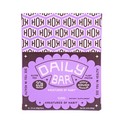 Kreatures of Habit Daily Bar cookie dough texture closeup emphasizes creamy flavor with chocolate chips.