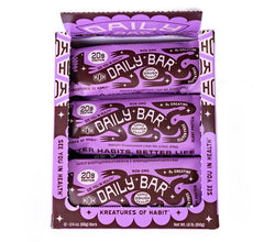 Kreatures of Habit Daily Bar held in hand suggests convenient on-the-go fuel.