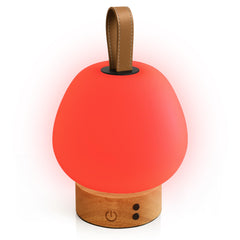 Liderstar red light therapy sleep lamp with 660nm glow on a bedside table for a calm night atmosphere
