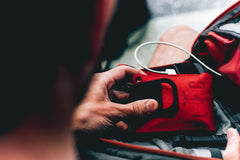 Live The Creed EDC kit contents displayed, including micro first aid kit and gloves for everyday readiness