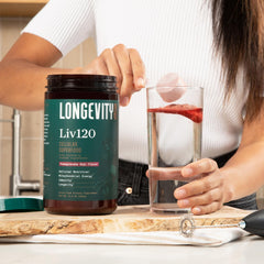 Longevity Rx Liv120 powder being poured into glass for energy and detox