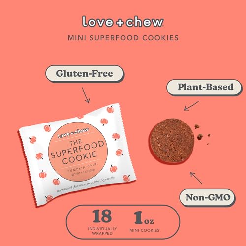 A hand holds Love + Chew mini vegan cookies for a quick snack.