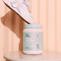 Love Sweat Fitness vanilla protein bag on kitchen counter.