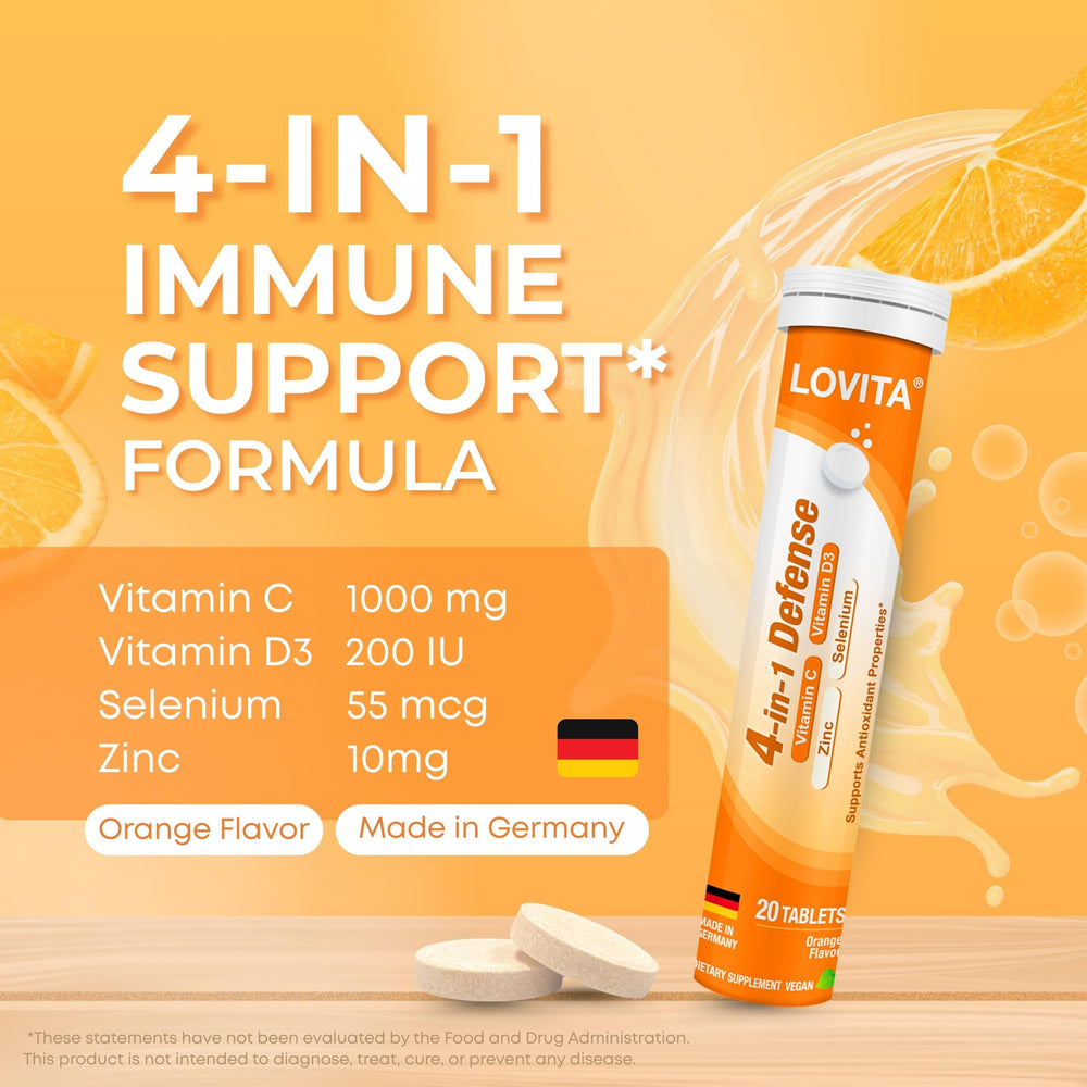 Lovita 4-in-1 Defense dissolving tablet in water with orange fizz.