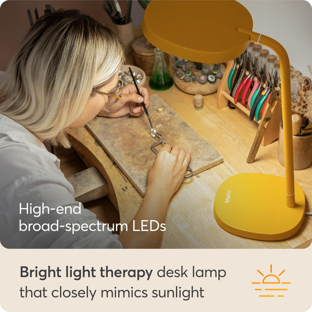 Lumie Task adjustable head, neck, and stem enable precise task lighting.
