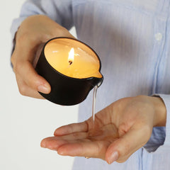 Luxmasa coconut-scent massage candle with natural oils for silky skin.