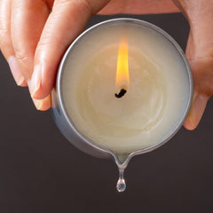 LUXMASA massage candle travel-friendly tin fits on nightstands or bags.