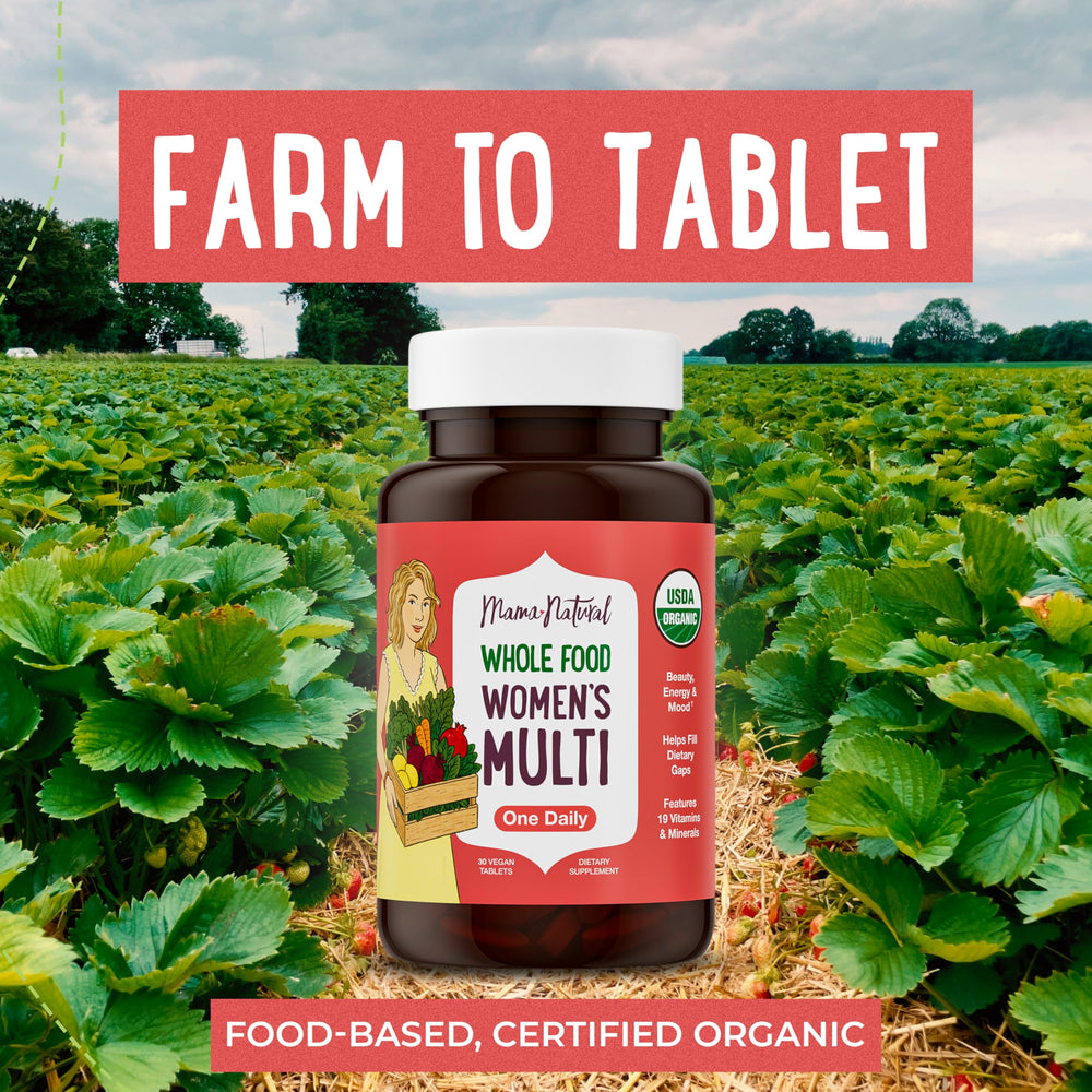 Mama Natural Organic Women's Multivitamin tablet close-up showing one-a-day vegan design.