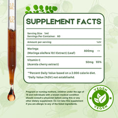 Pouring MaxuraFit Moringa Drops into water for quick absorption